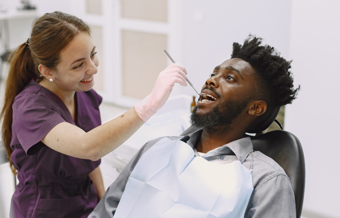 man receiving dental exam